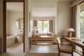 Luxury boutique hotel guestroom and bathroom showing resin bath collection, pandan accessories, and teak wood pieces all in unified warm sand and cream palette