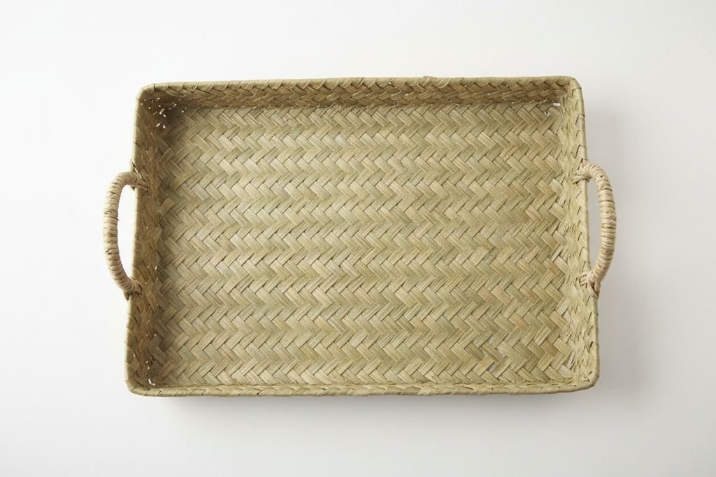 Overhead view of large pandan woven tray showing full weave pattern and integrated handles