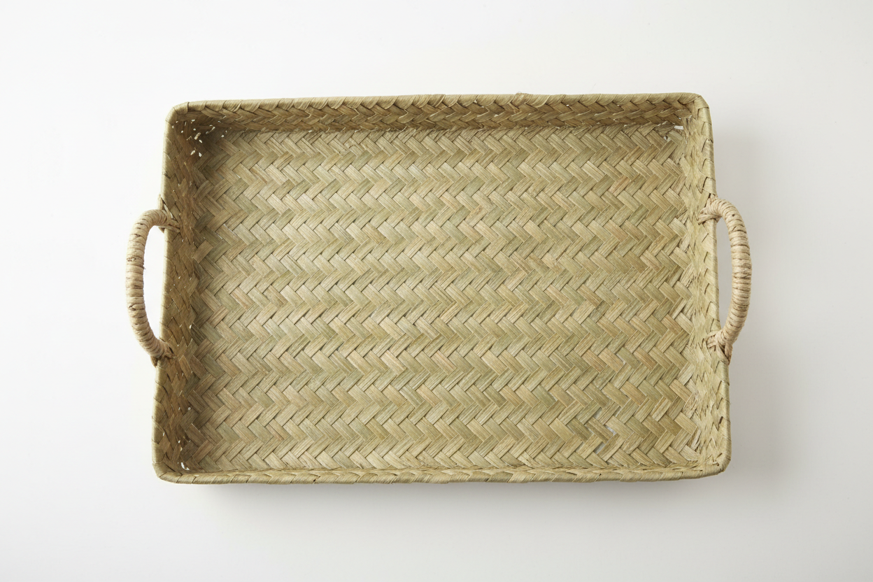 Overhead view of large pandan woven tray showing full weave pattern and integrated handles
